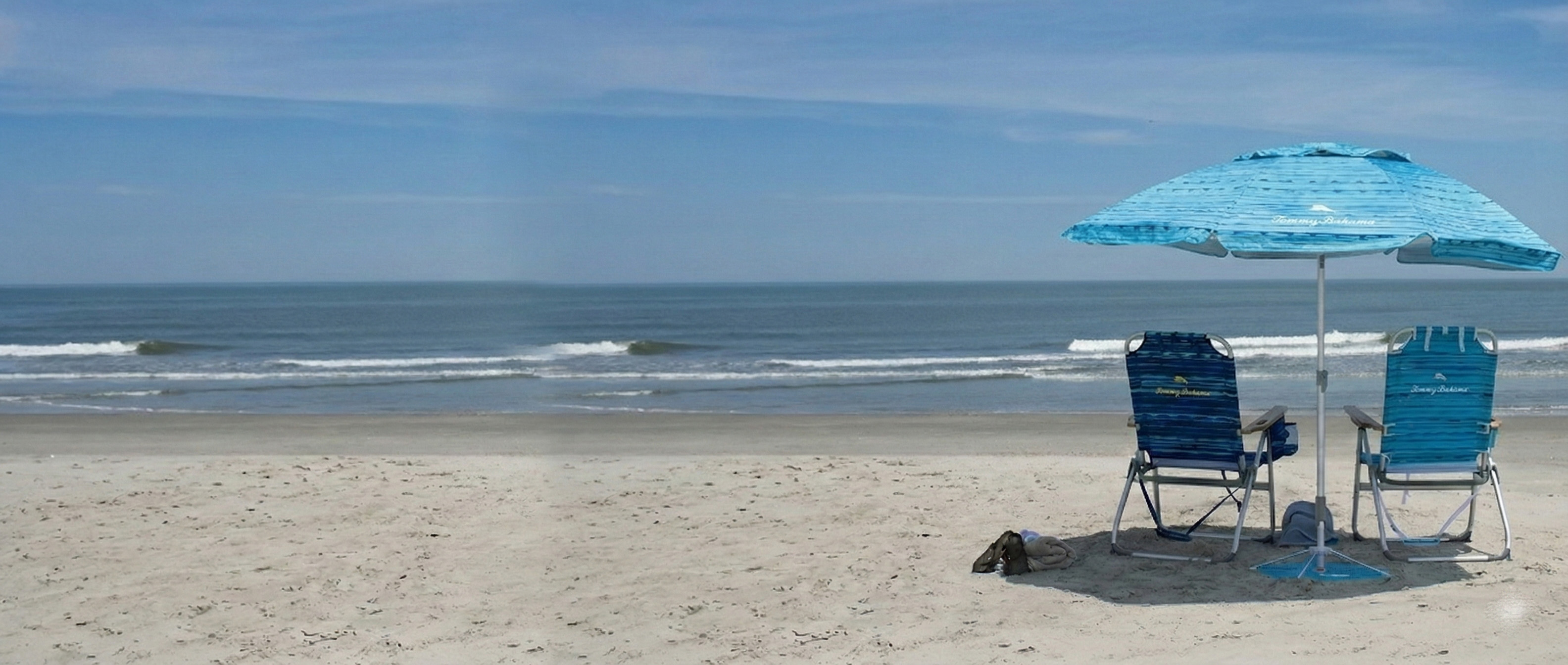Premium Tommy Bahama beach chairs and umbrella setup on Myrtle Beach